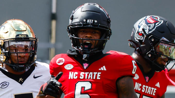 Oct 5, 2024; Raleigh, North Carolina, USA; North Carolina State Wolfpack wide receiver Wesley Grimes (6) celebrates during the first half of the game against Wake Forest Demon Deacons at Carter-Finley Stadium. Mandatory Credit: Jaylynn Nash-Imagn Images Oct 5, 2024; Raleigh, North Carolina, USA; North Carolina State Wolfpack wide receiver Wesley Grimes (6) celebrates during the first half of the game against Wake Forest Demon Deacons at Carter-Finley Stadium. Mandatory Credit: Jaylynn Nash-Imagn Images