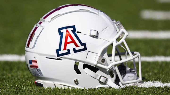 Nov 25, 2022; Tucson, Arizona, USA; Detailed view of an Arizona Wildcats helmet on the field during the Territorial Cup at Arizona Stadium. Mandatory Credit: Mark J. Rebilas-Imagn Images Nov 25, 2022; Tucson, Arizona, USA; Detailed view of an Arizona Wildcats helmet on the field during the Territorial Cup at Arizona Stadium. Mandatory Credit: Mark J. Rebilas-Imagn Images
