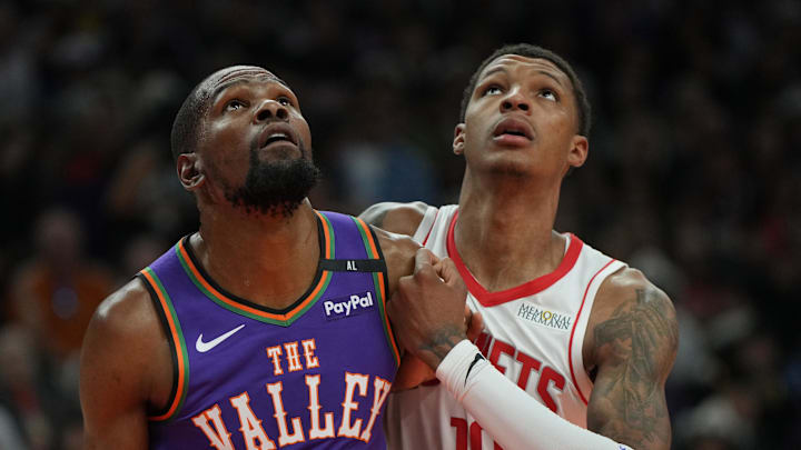 Mar 30, 2025; Phoenix, Arizona, USA; Phoenix Suns forward Kevin Durant (35) and Houston Rockets forward Jabari Smith Jr. (10) fight for position in the first half at Footprint Center. Mandatory Credit: Rick Scuteri-Imagn Images