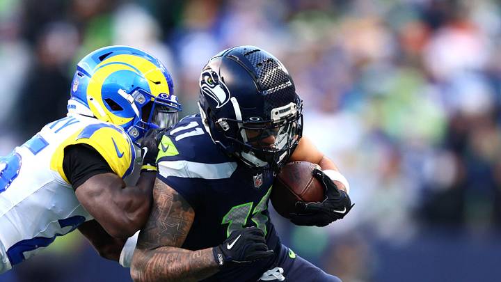 Jan 25, 2026; Seattle, WA, USA; Seattle Seahawks wide receiver Jaxon Smith-Njigba (11) runs against Los Angeles Rams cornerback Roger McCreary (25) during the first half in the 2026 NFC Championship Game at Lumen Field. Mandatory Credit: Kevin Ng-Imagn Images