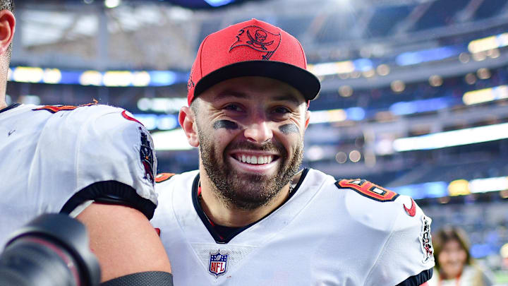 Dec 15, 2024; Inglewood, California, USA; Tampa Bay Buccaneers guard Ben Bredeson (68) and quarterback Baker Mayfield (6) celebrate the victory against the Los Angeles Chargers at SoFi Stadium. Mandatory Credit: Gary A. Vasquez-Imagn Images