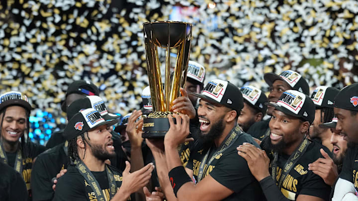 Dec 16, 2025; Las Vegas, Nevada, USA; New York Knicks center/forward Karl-Anthony Towns (32) and guard Jalen Brunson (11) hold the the Emirates NBA Cup trophy after victory over the San Antonio Spurs at T-Mobile Arena. Mandatory Credit: Kirby Lee-Imagn Images