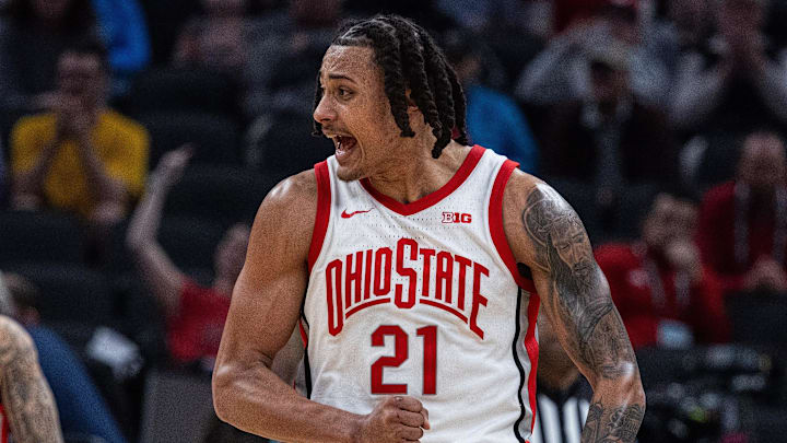 Mar 12, 2025; Indianapolis, IN, USA; Ohio State Buckeyes forward Devin Royal (21) celebrates a play in the second half against the Iowa Hawkeyes at Gainbridge Fieldhouse. Mandatory Credit: Trevor Ruszkowski-Imagn Images Mar 12, 2025; Indianapolis, IN, USA; Ohio State Buckeyes forward Devin Royal (21) celebrates a play in the second half against the Iowa Hawkeyes at Gainbridge Fieldhouse. Mandatory Credit: Trevor Ruszkowski-Imagn Images