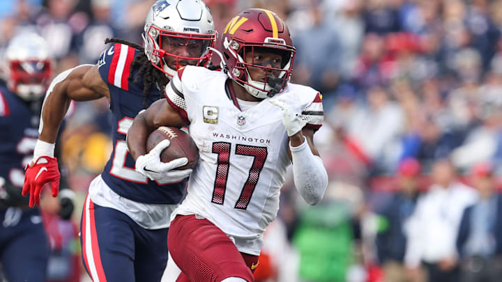 Nov 5, 2023; Foxborough, Massachusetts, USA; Washington Commanders receiver Terry McLaurin (17) runs the ball during the second half against the New England Patriots at Gillette Stadium. Mandatory Credit: Paul Rutherford-Imagn Images