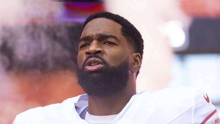 Arizona Cardinals quarterback Jacoby Brissett runs onto the field