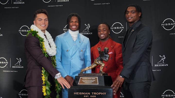 Dec 14, 2024; New York, NY, USA; From left, Heisman Trophy nominees Oregon Ducks quarterback Dillon Gabriel, Colorado Buffaloes wide receiver/cornerback Travis Hunter, Boise State Broncos running back Ashton Jeanty and Miami Hurricanes quarterback Cam Ward pose for a photo during a press conference before the 2024 Heisman Trophy Presentation. Mandatory Credit: Lucas Boland-Imagn Images