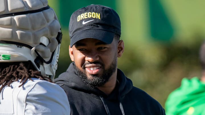 New Oregon running backs coach Ra’Shaad Samples talks with running back Jordan James during practice with the Oregon Ducks Tuesday, April 9, 2024, at the Hatfield-Dowlin Complex in Eugene, Ore.