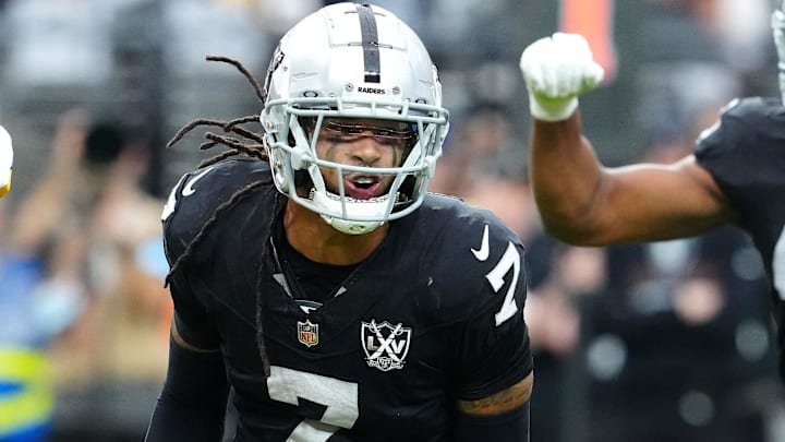 Oct 13, 2024; Paradise, Nevada, USA; Las Vegas Raiders safety Tre'von Moehrig (7) celebrates between Pittsburgh Steelers quarterback Justin Fields (2) and Las Vegas Raiders defensive end Charles Snowden (49) after making a defensive play against the Pittsburgh Steelers during the first quarter at Allegiant Stadium. Mandatory Credit: Stephen R. Sylvanie-Imagn Images