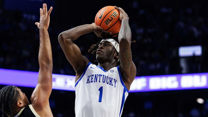 Oct 24, 2025; Lexington, KY, USA; Kentucky Wildcats guard Denzel Aberdeen (1) shoots the ball against Purdue Boilermakers guard C.J. Cox (0) during the second half at Rupp Arena at Central Bank Center. Mandatory Credit: Jordan Prather-Imagn Images