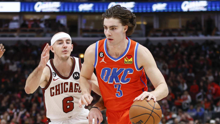 Jan 13, 2023; Chicago, Illinois, USA; Oklahoma City Thunder guard Josh Giddey (3) drives to the basket against Chicago Bulls guard Alex Caruso (6) during the second half at United Center. Mandatory Credit: Kamil Krzaczynski-USA TODAY Sports