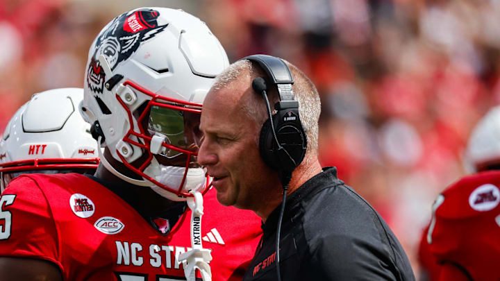 Sep 14, 2024; Raleigh, North Carolina, USA; North Carolina State Wolfpack tight end Justin Joly (15) and head coach Dave Doeren talk during the second half of the game against Louisiana Tech Bulldogs at Carter-Finley Stadium. Mandatory Credit: Jaylynn Nash-Imagn Images Sep 14, 2024; Raleigh, North Carolina, USA; North Carolina State Wolfpack tight end Justin Joly (15) and head coach Dave Doeren talk during the second half of the game against Louisiana Tech Bulldogs at Carter-Finley Stadium. Mandatory Credit: Jaylynn Nash-Imagn Images