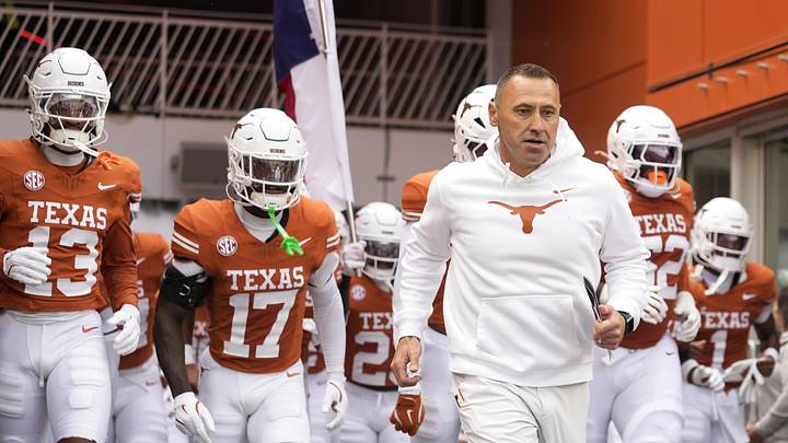 Texas Longhorns head coach Steve Sarkisian leads his team on to the field before a game against the Vanderbilt Commodores.