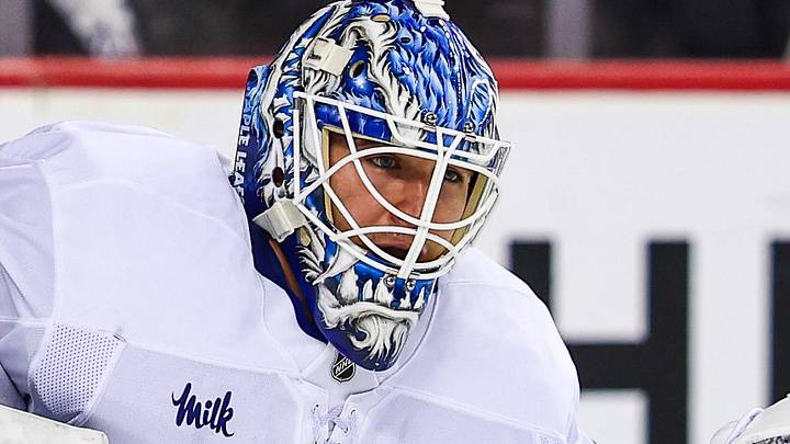Feb 2, 2026; Calgary, Alberta, CAN; Toronto Maple Leafs goaltender Joseph Woll (60) makes a save against the Calgary Flames during the second period at Scotiabank Saddledome. Mandatory Credit: Sergei Belski-Imagn Images