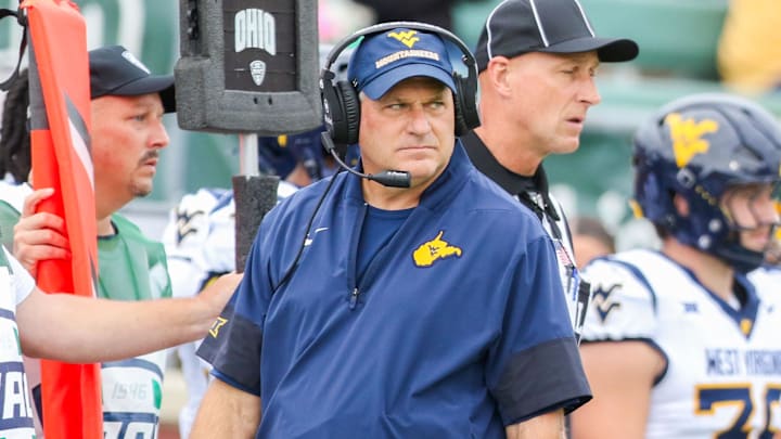 Sep 6, 2025; Athens, Ohio, USA; West Virginia Mountaineers head coach Rich Rodriguez walks along the sidelines during the first quarter against the Ohio Bobcats at Peden Stadium. Mandatory Credit: Ben Queen-Imagn Images Sep 6, 2025; Athens, Ohio, USA; West Virginia Mountaineers head coach Rich Rodriguez walks along the sidelines during the first quarter against the Ohio Bobcats at Peden Stadium. Mandatory Credit: Ben Queen-Imagn Images