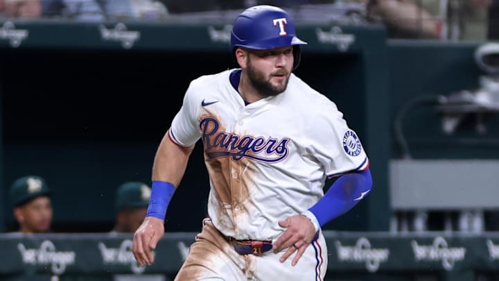 Apr 29, 2025; Arlington, Texas, USA; Texas Rangers first base Jake Burger (21) scores a run during the third inning against the Oakland Athletics at Globe Life Field.