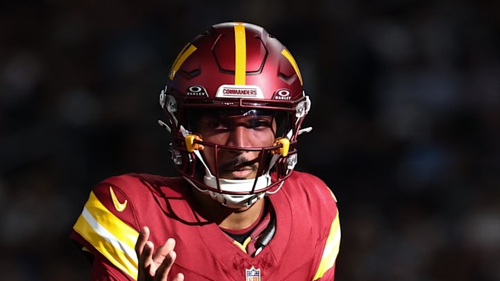 Washington Commanders quarterback Jayden Daniels calls a play at the line of scrimmage against the Dallas Cowboys. Washington Commanders quarterback Jayden Daniels calls a play at the line of scrimmage against the Dallas Cowboys.