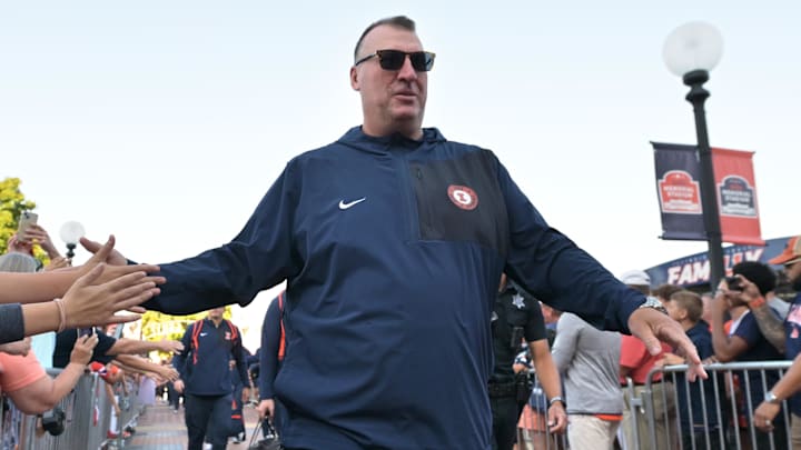 Sep 27, 2025; Champaign, Illinois, USA; Illinois Fighting Illini head coach Bret Bielema leads his team down the Illini Walk before an NCAA football game with the Southern California Trojans at Memorial Stadium. Mandatory Credit: Ron Johnson-Imagn Images Sep 27, 2025; Champaign, Illinois, USA; Illinois Fighting Illini head coach Bret Bielema leads his team down the Illini Walk before an NCAA football game with the Southern California Trojans at Memorial Stadium. Mandatory Credit: Ron Johnson-Imagn Images