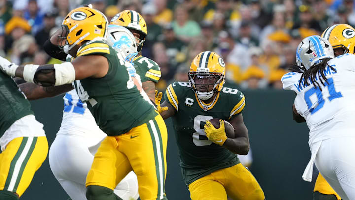 Sep 7, 2025; Green Bay, Wisconsin, USA; Green Bay Packers running back Josh Jacobs (8) runs with the ball against the Detroit Lions at Lambeau Field. Mandatory Credit: Wm. Glasheen-USA TODAY Network via Imagn Images