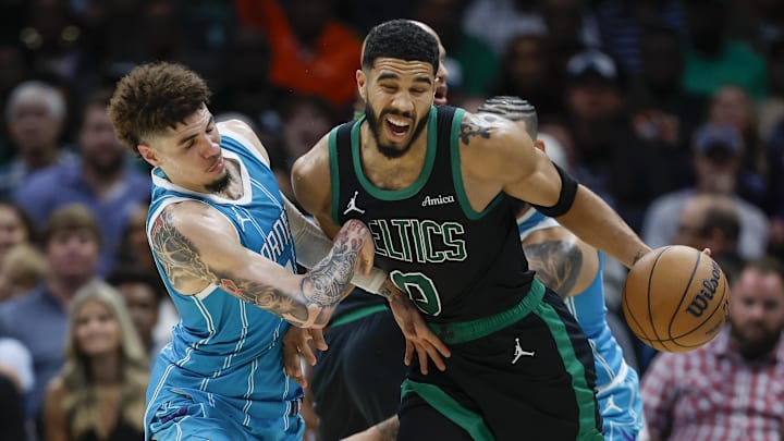 Nov 2, 2024; Charlotte, North Carolina, USA; Boston Celtics forward Jayson Tatum (0) collides with Charlotte Hornets guard LaMelo Ball (1) during the second half at Spectrum Center. Mandatory Credit: Nell Redmond-Imagn Images Nov 2, 2024; Charlotte, North Carolina, USA; Boston Celtics forward Jayson Tatum (0) collides with Charlotte Hornets guard LaMelo Ball (1) during the second half at Spectrum Center. Mandatory Credit: Nell Redmond-Imagn Images