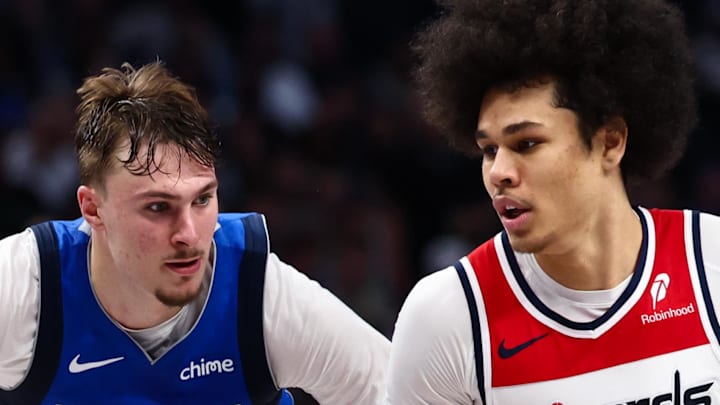 Washington Wizards forward Kyshawn George drives to the basket as Dallas Mavericks forward Cooper Flagg defends. Washington Wizards forward Kyshawn George drives to the basket as Dallas Mavericks forward Cooper Flagg defends.