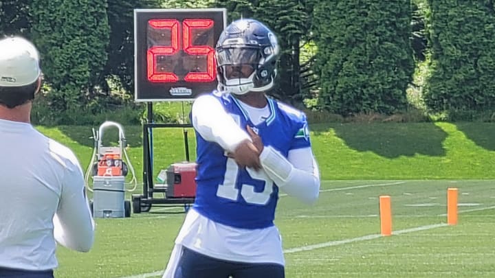 Seattle Seahawks quarterback PJ Walker throws during warmups at mandatory minicamp.