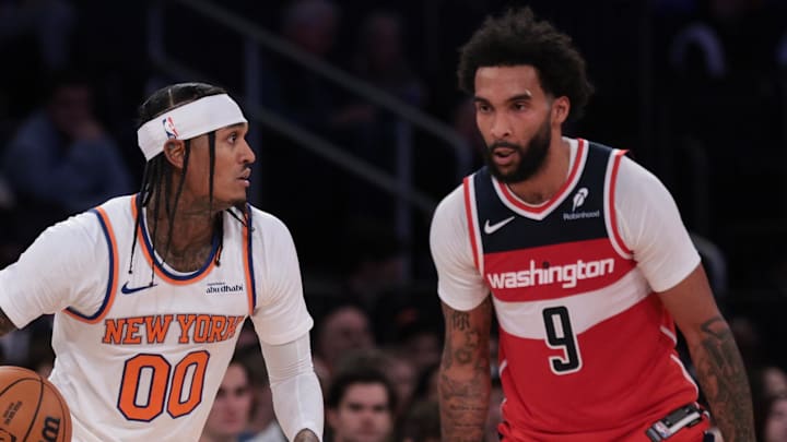 Oct 13, 2025; New York, New York, USA; New York Knicks guard Jordan Clarkson (00) dribbles against Washington Wizards guard/forward Justin Champagnie (9) during the second half at Madison Square Garden. Mandatory Credit: Vincent Carchietta-Imagn Images