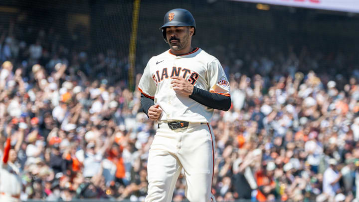 May 18, 2025; San Francisco, California, USA; San Francisco Giants first base LaMonte Wade Jr. (31) comes home after a single by San Francisco Giants catcher Patrick Bailey (14) during the eighth inning against the Oakland Athletics at Oracle Park. 