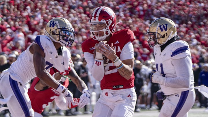 Indiana Hoosiers quarterback Tayven Jackson (2) runs for a touchdown against Washington at Memorial Stadium. Indiana Hoosiers quarterback Tayven Jackson (2) runs for a touchdown against Washington at Memorial Stadium.