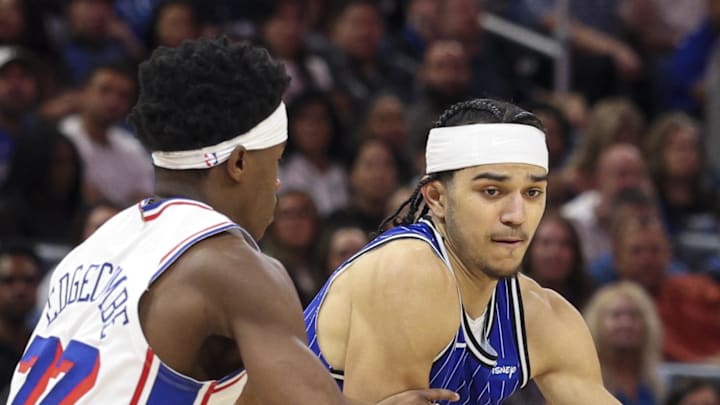 Orlando Magic guard Anthony Black is guarded by Philadelphia 76ers guard VJ Edgecombe. Orlando Magic guard Anthony Black is guarded by Philadelphia 76ers guard VJ Edgecombe.