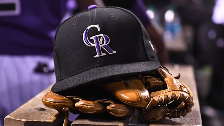 Aug 4, 2017; Denver, CO, USA; General view of the hat and glove of Colorado Rockies shortstop Pat Valaika (4) (not pictured) in the seventh inning against the Philadelphia Phillies at Coors Field.