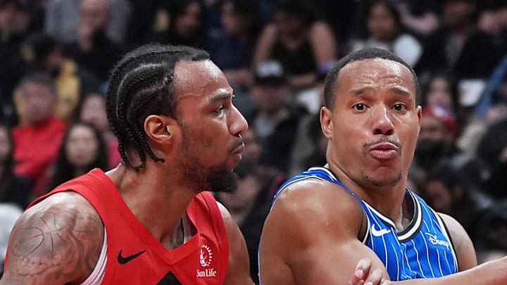Orlando Magic guard Desmond Bane controls the ball as Toronto Raptors guard A.J. Lawson tries to defend.