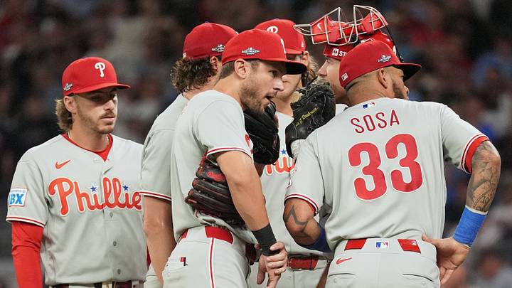 Oct 1, 2026; Cumberland, Georgia, USA; Philadelphia Phillies starting pitcher Aaron Nola (27) meets with teammates on the mound against the Atlanta Braves during the first inning in game three of the Wildcard round for the 2026 MLB Playoffs at Truist Field. Mandatory Credit: Dale Zanine-Imagn Images Oct 1, 2026; Cumberland, Georgia, USA; Philadelphia Phillies starting pitcher Aaron Nola (27) meets with teammates on the mound against the Atlanta Braves during the first inning in game three of the Wildcard round for the 2026 MLB Playoffs at Truist Field. Mandatory Credit: Dale Zanine-Imagn Images
