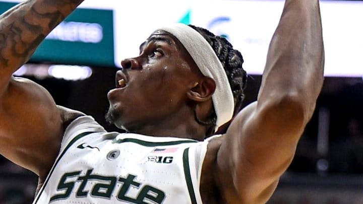 Michigan State's Coen Carr, right, shoots as Ohio State's Amare Bynum defends during the first half on Sunday, Feb. 22, 2026, at the Breslin Center in East Lansing.