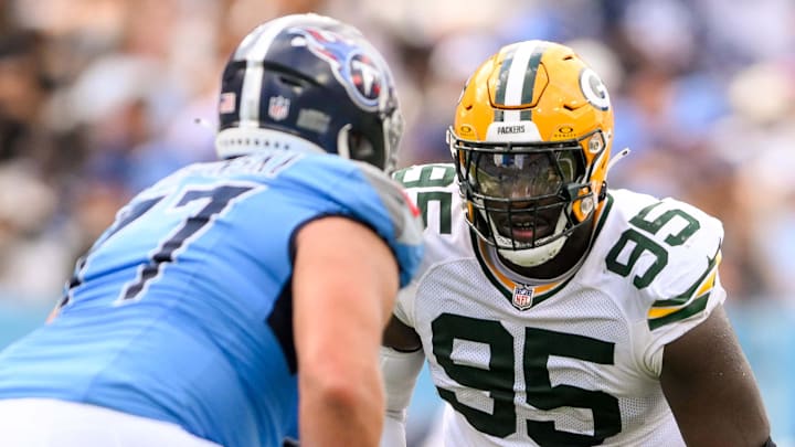 Green Bay Packers defensive tackle Devonte Wyatt (95) goes against Tennessee Titans offensive tackle Peter Skoronski (77).