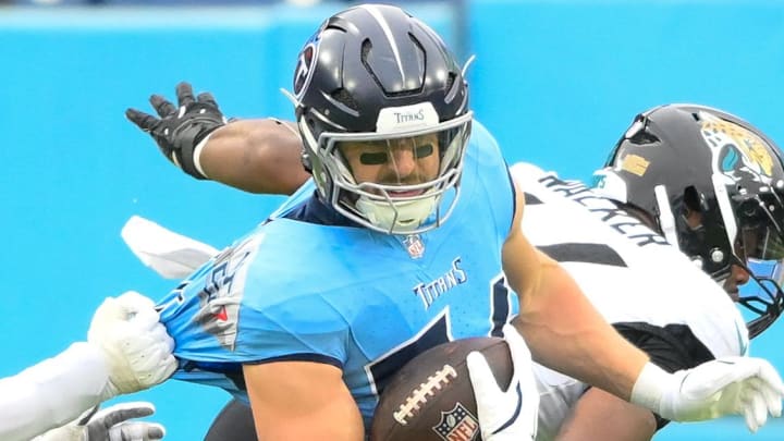 Tennessee Titans tight end Josh Whyle (81) runs the ball after a catch against Jacksonville in 2024.