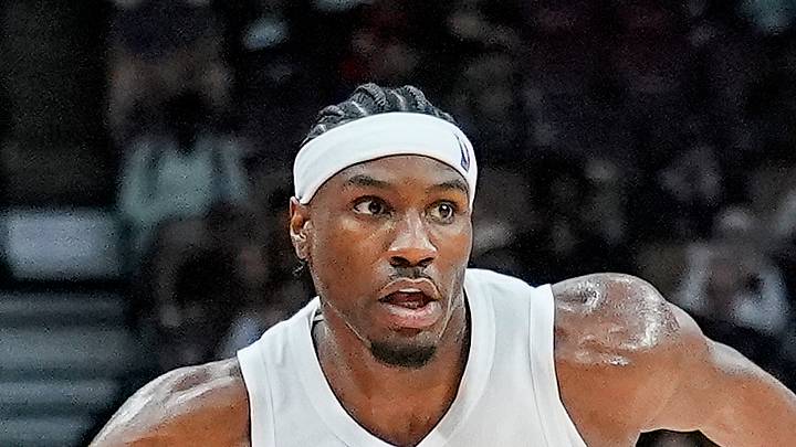 Toronto Raptors guard Ja'Kobe Walter keeps a ball in play against the New York Knicks.