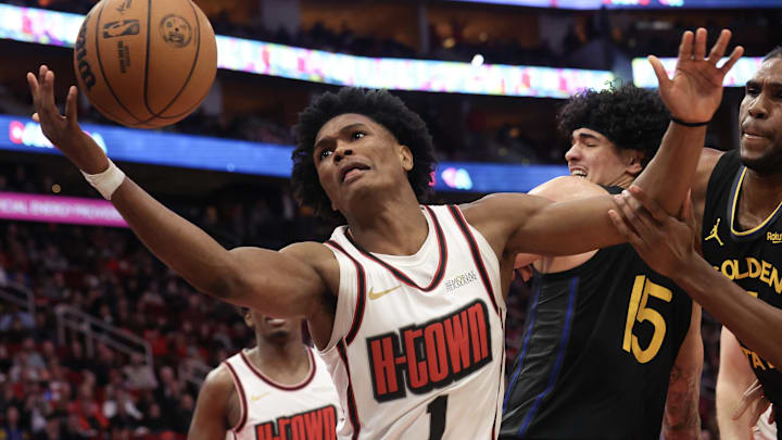 Feb 13, 2025; Houston, Texas, USA; Houston Rockets forward Amen Thompson (1) and Golden State Warriors forward Kevon Looney (5) reach for a rebound in the second half at Toyota Center. Mandatory Credit: Thomas Shea-Imagn Images Feb 13, 2025; Houston, Texas, USA; Houston Rockets forward Amen Thompson (1) and Golden State Warriors forward Kevon Looney (5) reach for a rebound in the second half at Toyota Center. Mandatory Credit: Thomas Shea-Imagn Images