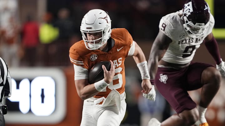 Texas Longhorns quarterback Arch Manning keeps the ball and runs for a touchdown during the second half against the Texas A&M Aggies at Darrell K Royal-Texas Memorial Stadium.