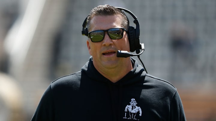 Purdue Boilermakers offensive coordinator Josh Henson looks downfield 