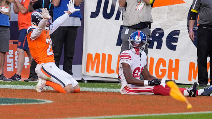 October 19, 2025: Denver Broncos cornerback Riley Moss (21) indicates incomplete as New York Giants wide receiver Beaux Collins (81) looks on in the second half of the football game between the Denver Broncos and New York Giants. The flag was for pass interference that gave the Giants the ball at the one with under 1 minute to play. 