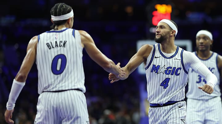 Nov 25, 2025; Philadelphia, Pennsylvania, USA; Orlando Magic guard Anthony Black (0) reacts with guard Jalen Suggs (4) after scoring against the Philadelphia 76ers during the second quarter at Xfinity Mobile Arena. Mandatory Credit: Bill Streicher-Imagn Images Nov 25, 2025; Philadelphia, Pennsylvania, USA; Orlando Magic guard Anthony Black (0) reacts with guard Jalen Suggs (4) after scoring against the Philadelphia 76ers during the second quarter at Xfinity Mobile Arena. Mandatory Credit: Bill Streicher-Imagn Images