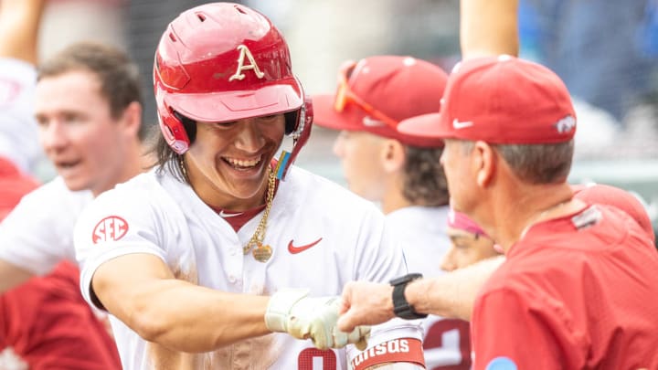 Arkansas Razorbacks shortstop Wehiwa Aloy is congratulated by coach Dave Van Horn after his home run last sea in the Fayetteville Regional of the NCAA Tournament. Arkansas Razorbacks shortstop Wehiwa Aloy is congratulated by coach Dave Van Horn after his home run last sea in the Fayetteville Regional of the NCAA Tournament.