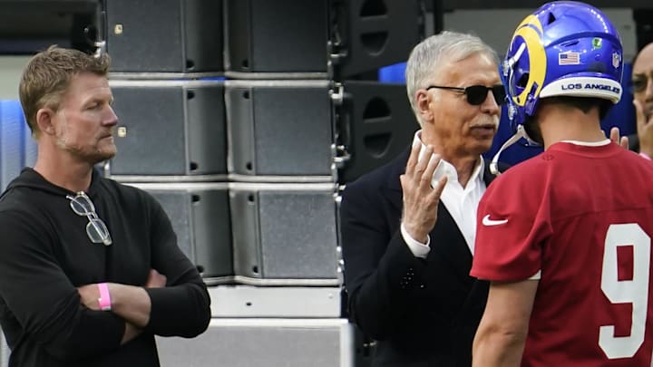 Jun 10, 2021; Los Angeles, CA, USA; Los Angeles Rams owner Stan Kroenke (center) talks to quarterback Matthew Stafford (9) before the start of an offseason workout SoFi Stadium. Left is team general manager Les Snead. Mandatory Credit: Robert Hanashiro-Imagn Images Jun 10, 2021; Los Angeles, CA, USA; Los Angeles Rams owner Stan Kroenke (center) talks to quarterback Matthew Stafford (9) before the start of an offseason workout SoFi Stadium. Left is team general manager Les Snead. Mandatory Credit: Robert Hanashiro-Imagn Images