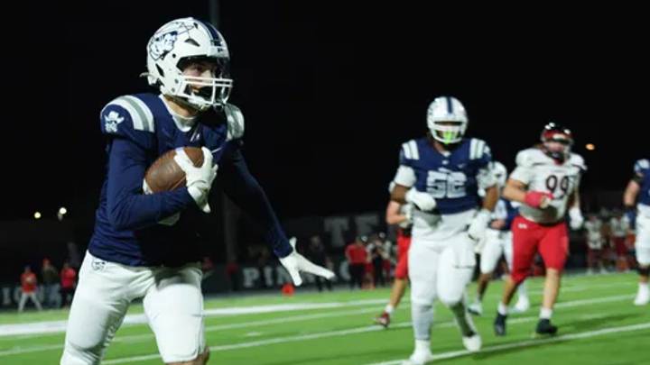 Pinnacle tight end Tyson Muniz (8) runs down the field and Liberty chases him out of bounds during a game at Pinnacle High School on Sept. 26, 2025, in Phoenix. Pinnacle tight end Tyson Muniz (8) runs down the field and Liberty chases him out of bounds during a game at Pinnacle High School on Sept. 26, 2025, in Phoenix.