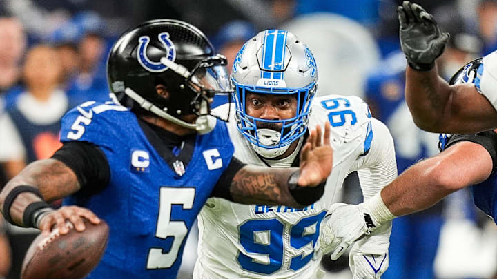 Detroit Lions defensive end Za'Darius Smith (99) pressures Indianapolis Colts quarterback Anthony Richardson (5) Detroit Lions defensive end Za'Darius Smith (99) pressures Indianapolis Colts quarterback Anthony Richardson (5)