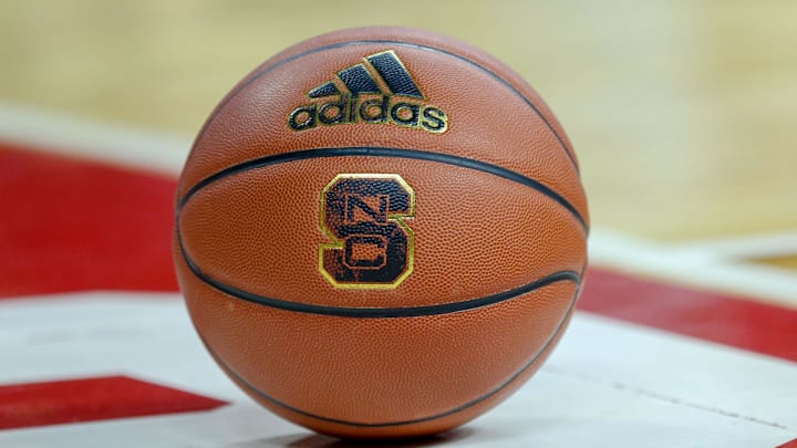 Feb 20, 2019; Raleigh, NC, USA; Basketball with the North Carolina State Wolfpack logo sits on the court during a timeout as the Wolfpack play the Boston College Eagles in the first half at PNC Arena. The North Carolina State Wolfpack won 89-80. Mandatory Credit: Nell Redmond-Imagn Images