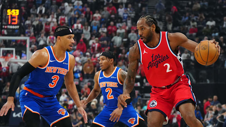 Mar 7, 2025; Inglewood, California, USA; LA Clippers forward Kawhi Leonard (2) dribbles the ball against New York Knicks guard Miles McBride (2) and guard Josh Hart (3) in the first half at Intuit Dome. Mandatory Credit: Kirby Lee-Imagn Images