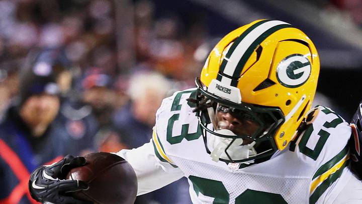 Green Bay Packers running back Emanuel Wilson runs with the ball against Chicago Bears safety Kevin Byard III. Green Bay Packers running back Emanuel Wilson runs with the ball against Chicago Bears safety Kevin Byard III.