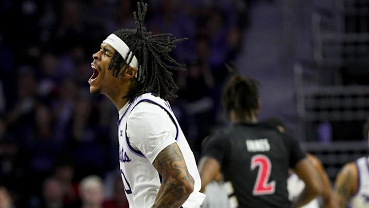 Dec 30, 2024; Manhattan, Kansas, USA; Kansas State Wildcats guard Dug McDaniel (0) celebrates after scoring during the first half against the Cincinnati Bearcats at Bramlage Coliseum. Mandatory Credit: Jay Biggerstaff-Imagn Images