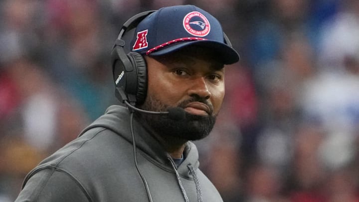 Oct 20, 2024; London, United Kingdom; New England Patriots coach Jerod Mayo watches from the sidelines against the New England Patriots in the second half of an NFL International Series game at Wembley Stadium. Mandatory Credit: Kirby Lee-Imagn Images